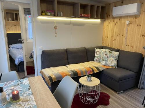 a living room with a couch and a table at Holiday Home Renate by Interhome in Wemding
