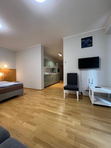 a bedroom with a bed and a desk in a room at Apartments in Residence Garden Towers in Prague