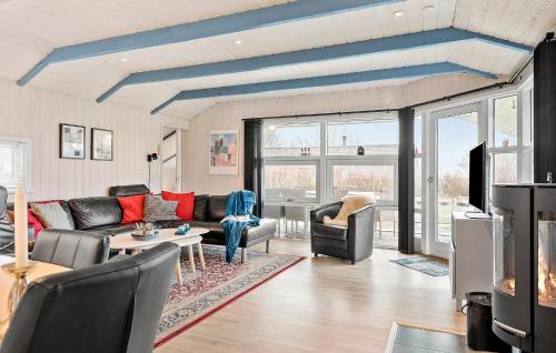 a living room with a couch and a table at Holiday Home Slåenvænget Hejls X Denmark in Hejls