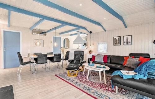 a living room with a couch and a table at Holiday Home Slåenvænget Hejls X Denmark in Hejls
