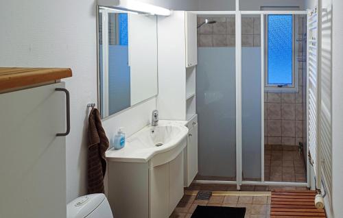 a bathroom with a sink and a shower at Nice Apartment In Hyltebruk With 2 Bedrooms And Wifi in Hyltebruk