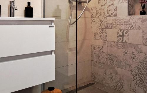 a shower with a glass door in a bathroom at 2 Bedroom Nice Apartment In Slano in Slano