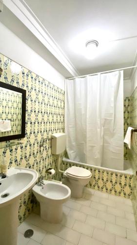 a bathroom with a toilet and a sink at Chiado Apartment with Terrace 1 in Lisbon