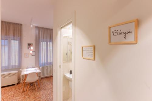 a bathroom with a sink and a toilet in a room at M&M Apartment in Bologna