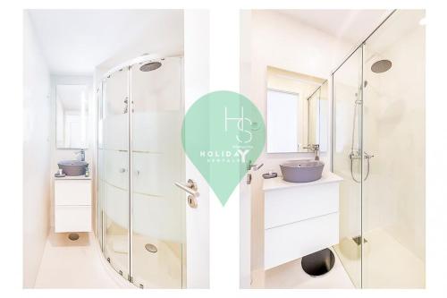 a bathroom with two sinks and a shower at Vista dos Seus Sonhos T2 HsR Vilamarina in Quarteira