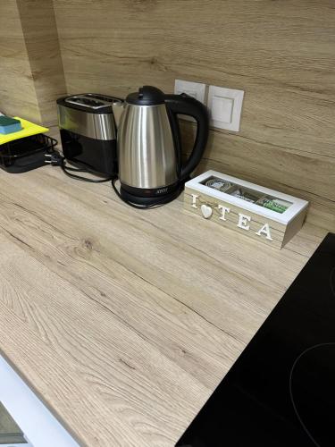 a coffee pot sitting on top of a counter at Navarino Luxe Suites in Perea