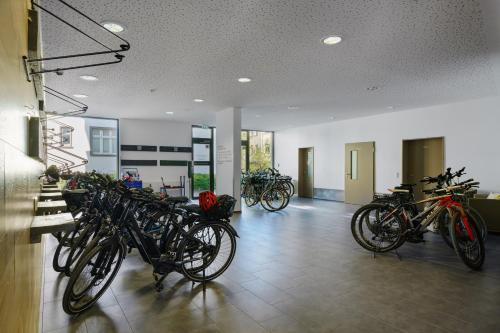 a group of bikes parked in a room at Radlon Fahrrad-Komfort-Hotel in Waren