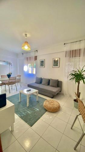 a living room with a couch and a table at Chiado Appartment with Terrace 2 in Lisbon