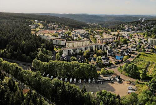 an aerial view of a town with trees and buildings at Pension Haus Flora in Oberhof