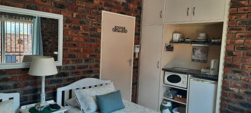 Kuchyň nebo kuchyňský kout v ubytování Coral Tree Guest Rooms