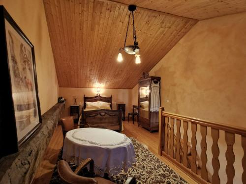 a bedroom with a bed and a wooden ceiling at Gîte Lorlanges, 3 pièces, 8 personnes - FR-1-582-352 in Lorlanges