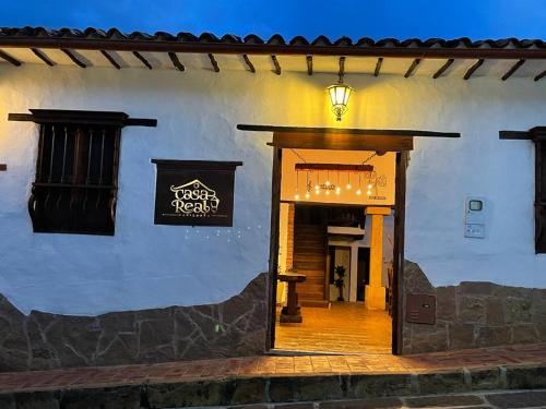 an entrance to a building with a sign on it at Casa Real Barichara in Barichara
