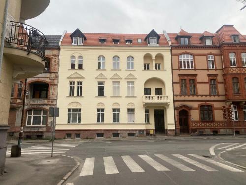 a large white building on a city street at 31-Vezuvio - DeerRest Apart in Jelenia Góra