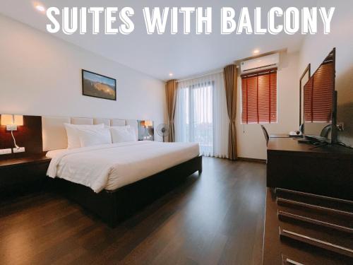 a hotel room with a bed and a television at Paragon House and Residence in Hanoi