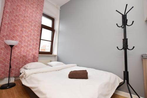 Katil atau katil-katil dalam bilik di City Central Hostel - Pokoje prywatne
