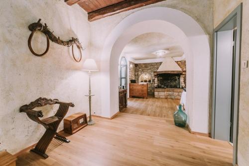 a large living room with a wooden floor and a fireplace at Bed and Breakfast Kolo Adults only in Novigrad Istria
