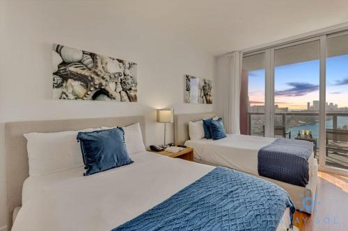 Postel nebo postele na pokoji v ubytování Beachwalk - Sun, Amazing Pools and Gym