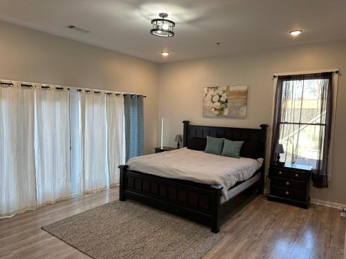 a bedroom with a bed and a large window at Decatur Delight Mixed- Use Apartments! in Decatur