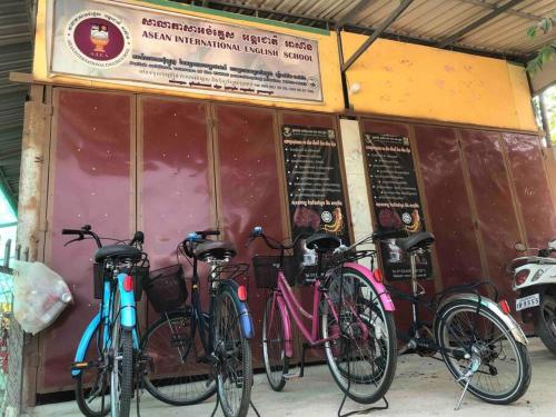 a group of bikes parked in front of a restaurant at Countryside Schoolstay in Takeo