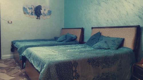 Jordanian family hosting tesisinde bir odada yatak veya yataklar