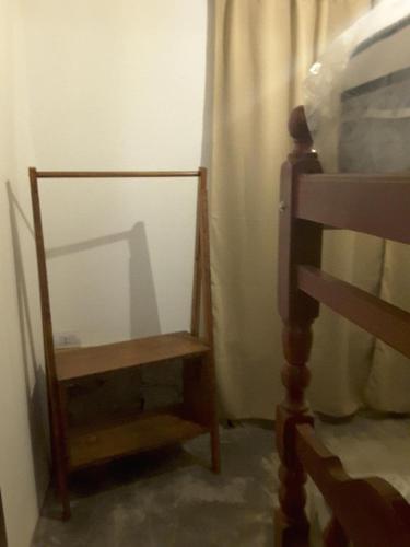 a mirror sitting next to a chair in a room at 4 ELEMENTOS in Huacalera