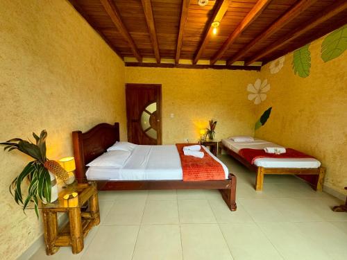 a bedroom with two beds in a room at Wisdom Forest Lodge in Tena