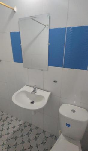 a bathroom with a toilet and a sink at Apto-studio en renta amoblado in Neiva