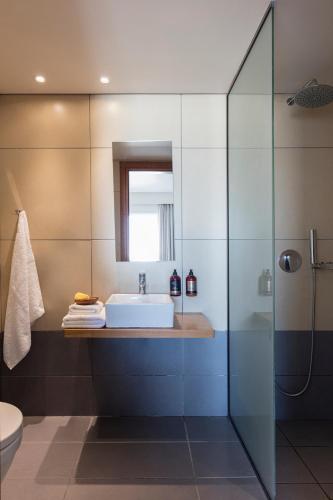 a bathroom with a sink and a mirror at Anastasia Hotel in Kos