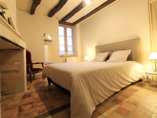 a bedroom with a large bed in a room at Gîte Baugé en Anjou, 5 pièces, 6 personnes - FR-1-622-29 in Baugé-en-Anjou