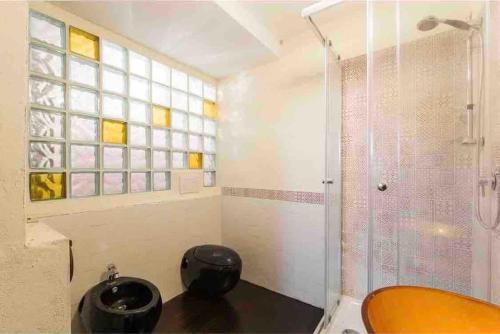 a bathroom with a shower and a sink at Magic Loft Underground in Rome