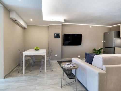 a living room with a couch and a table at Europa APT - Dolcevita Holiday in Florence