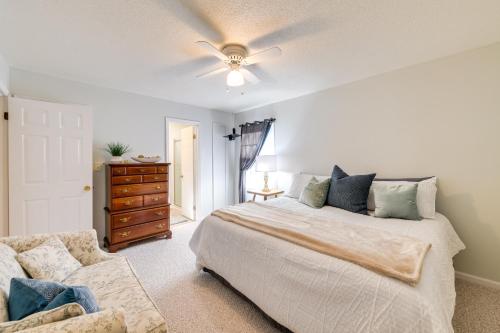 a bedroom with a bed and a ceiling fan at Charming Emporia Home with Deck and Patio! in Emporia