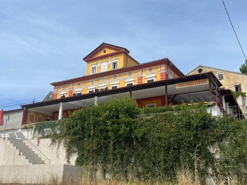 a building on the side of a hill with stairs at Hotel Heritage in Veli Lošinj