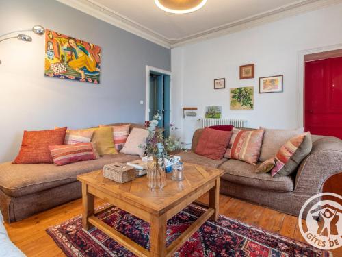 a living room with two couches and a coffee table at Maison de maître avec piscine et jardin - cœur des Coteaux du Layon, proche Angers et Saumur - FR-1-622-55 in Faye-dʼAnjou