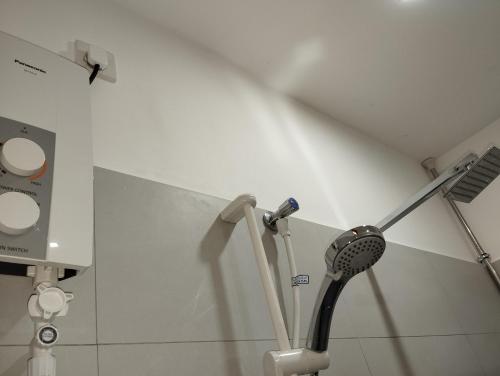 a bathroom with a hair brush and a wall at Serene Bliss Villa in Unawatuna