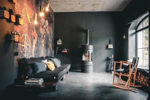 a living room with a couch and a stove at Debed Life CoLiving and Retreat in Debed