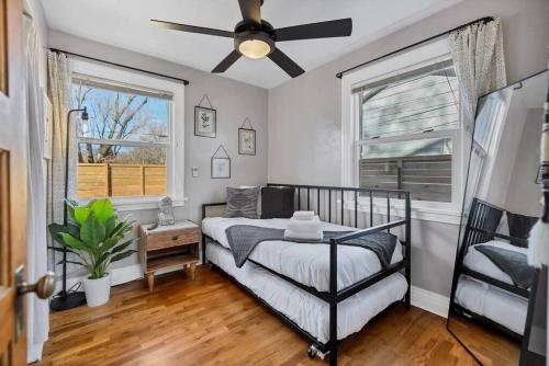 a bedroom with a bed and a ceiling fan at Casa Mosaic Executive Rental 3bedroom Smart TV in Colorado Springs