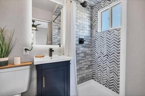 a bathroom with a sink and a shower at Casa Mosaic Executive Rental 3bedroom Smart TV in Colorado Springs