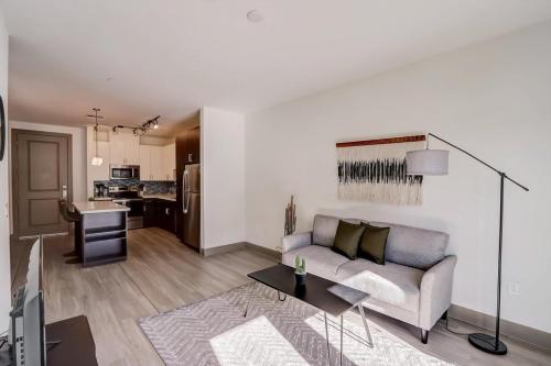 a living room with a couch and a table at Modern CozySuites on the Town Lake waterfront 18 in Tempe