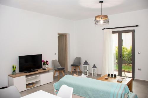 A television and/or entertainment centre at Christina Apartment