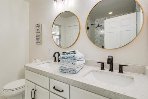 a bathroom with a sink and a mirror at Centrally Located Austin Home with Private Patio! in Austin
