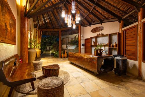 Гостиная зона в Vila Coqueiros Boutique Hotel