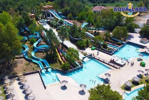 an aerial view of a water park with a water slide at Villa Elena in Áfra