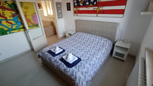 Postel nebo postele na pokoji v ubytování Appartamento Pinocchio Posatora Torrette