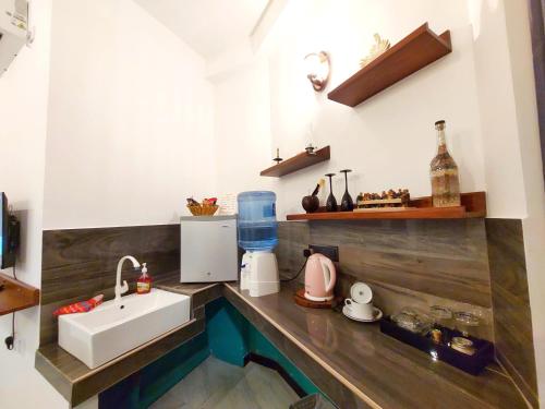 a kitchen with a sink and a counter at CHEN VILLA - Near Airport in Negombo
