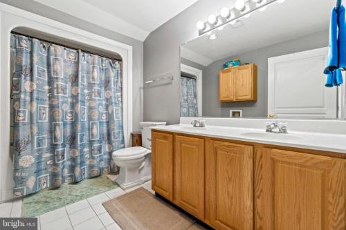 a bathroom with a sink and a toilet at Stafford Virginia Stay in Stafford