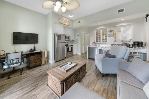 a living room with a couch and a table at Lazy Daze at Gulf Place 208 in Santa Rosa Beach