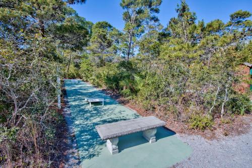 a bench sitting on the side of a river at Lazy Daze at Gulf Place 208 in Santa Rosa Beach