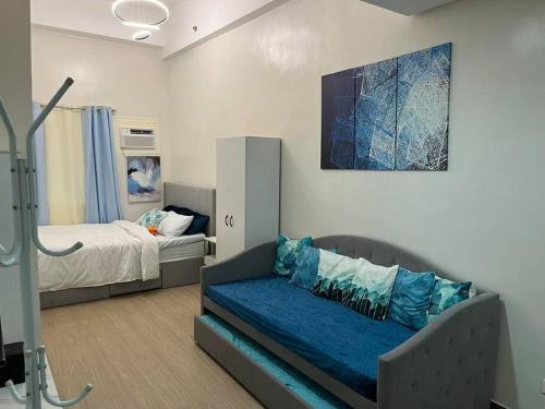 Cama ou camas em um quarto em Athena's Place - Hope Residences SMDC Trece Cavite