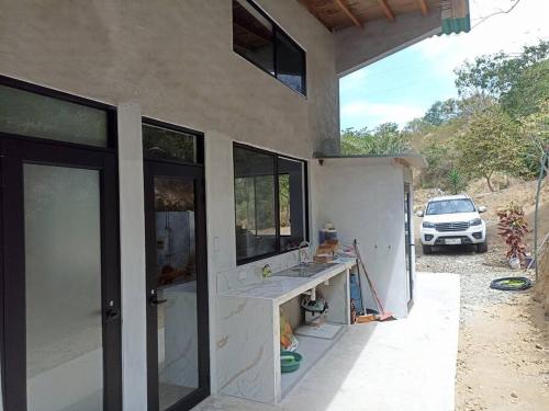 a house being remodeled with a car in the background at Ayampe Kachalotes, Beach house, The best view in Ayampe